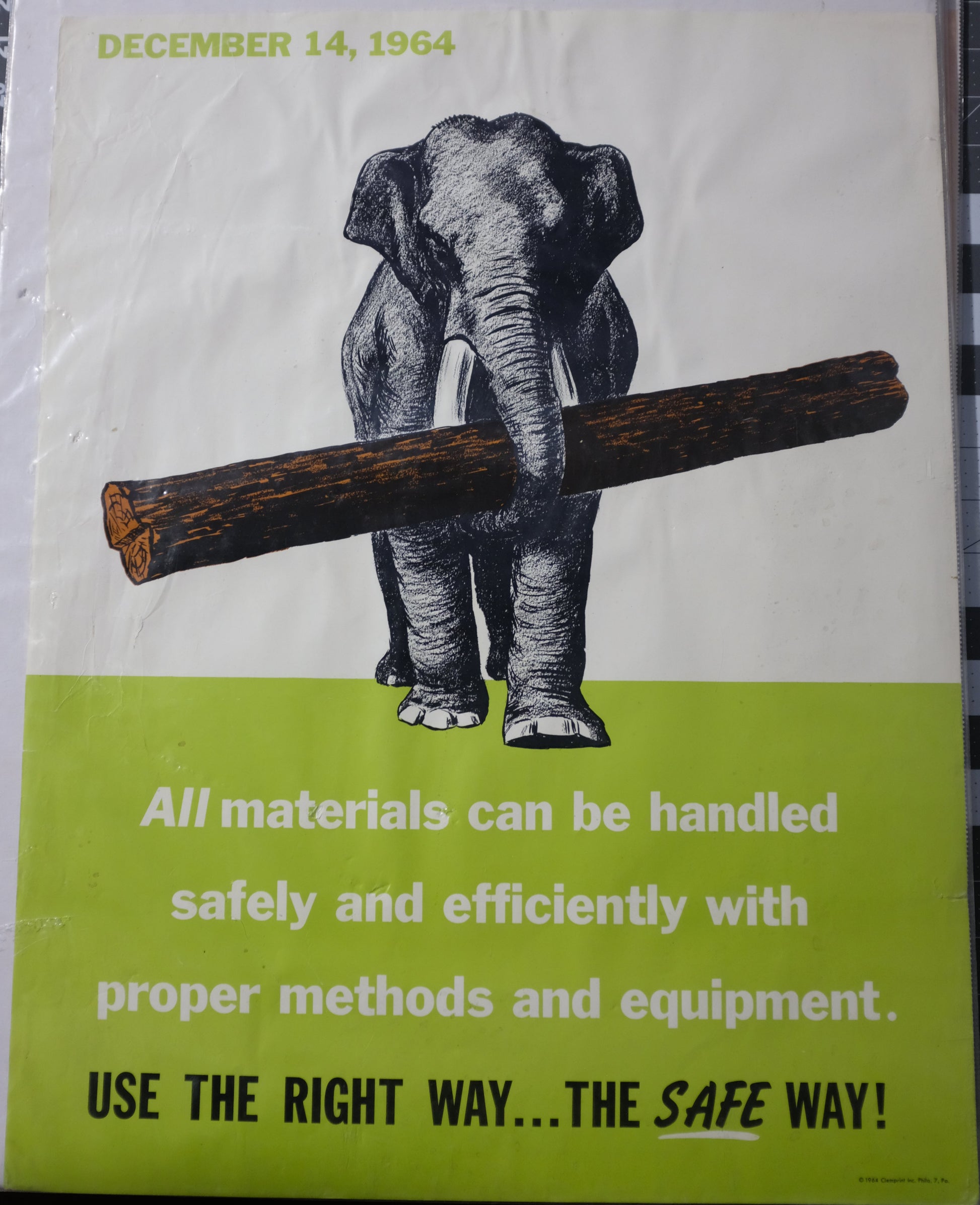 Safety poster with an elephant and tree trunk illustration on a green and white background